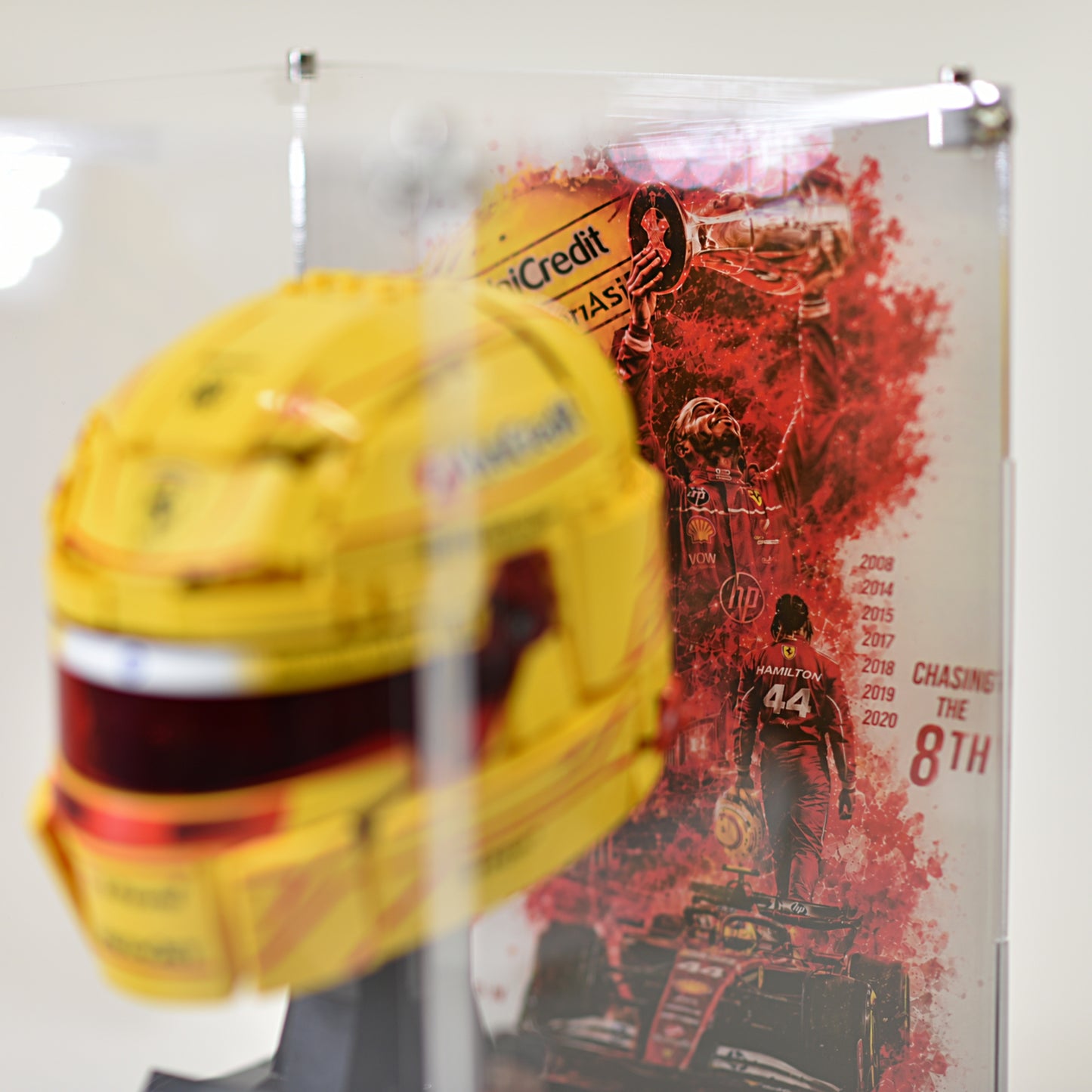 Close-Up of LEGO Ferrari Helmet Display Case with Black Base